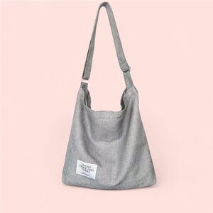 Grey canvas shoulder tote bag with adjustable straps
